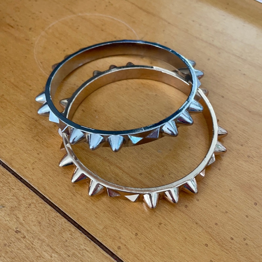 Gold and silver bracelets with spikes